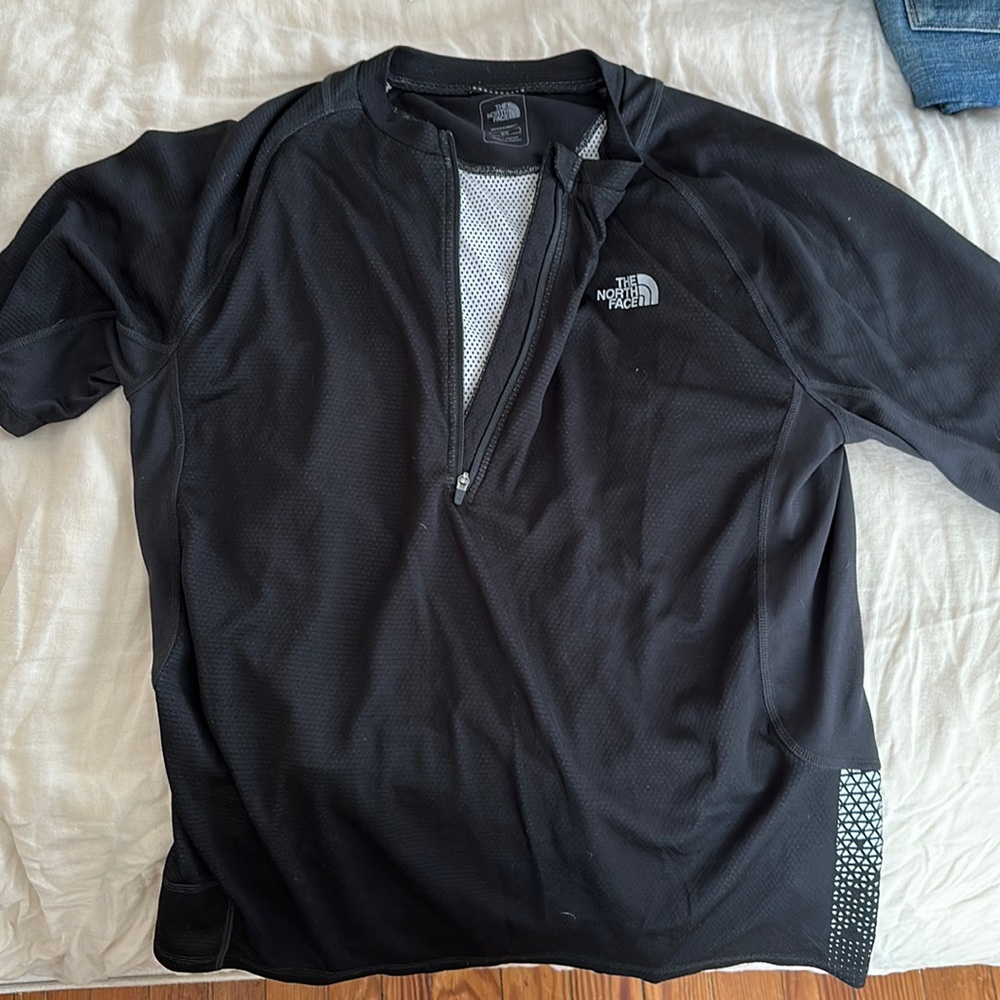 North face cycling shirt with zipper and zipper back pocket. Medium like new